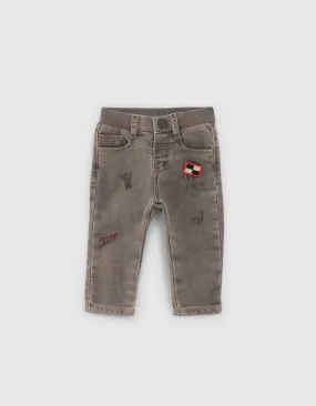 Jean gris avec print et badge bébé garçon